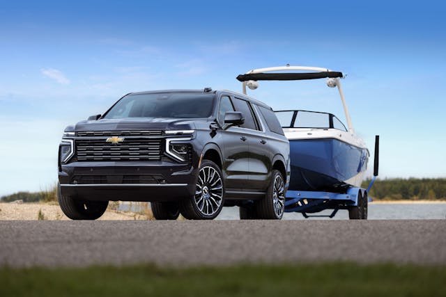 2025 Chevrolet Suburban High Country front three quarter towing boat
