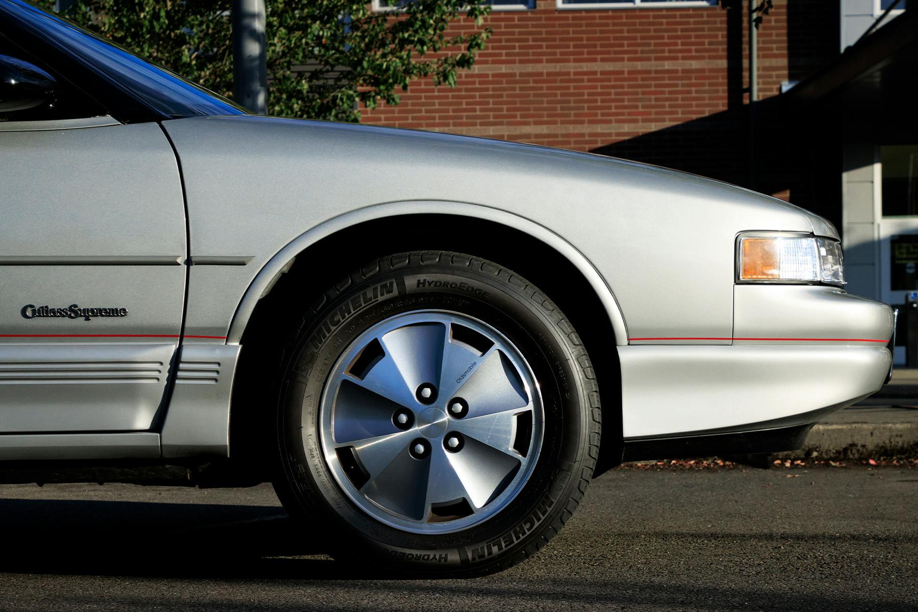 1991 Oldsmobile Cutlass Supreme Convertible front end side view