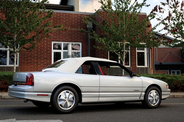 1991 Oldsmobile Cutlass Supreme Convertible rear three quarter top on window down