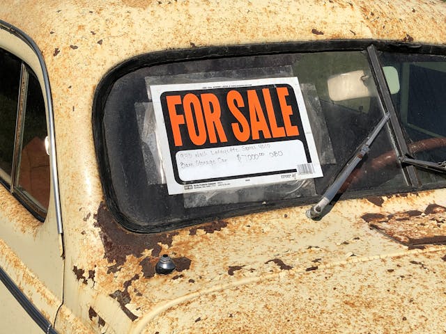 For Sale sign on patina vintage classic car windshield