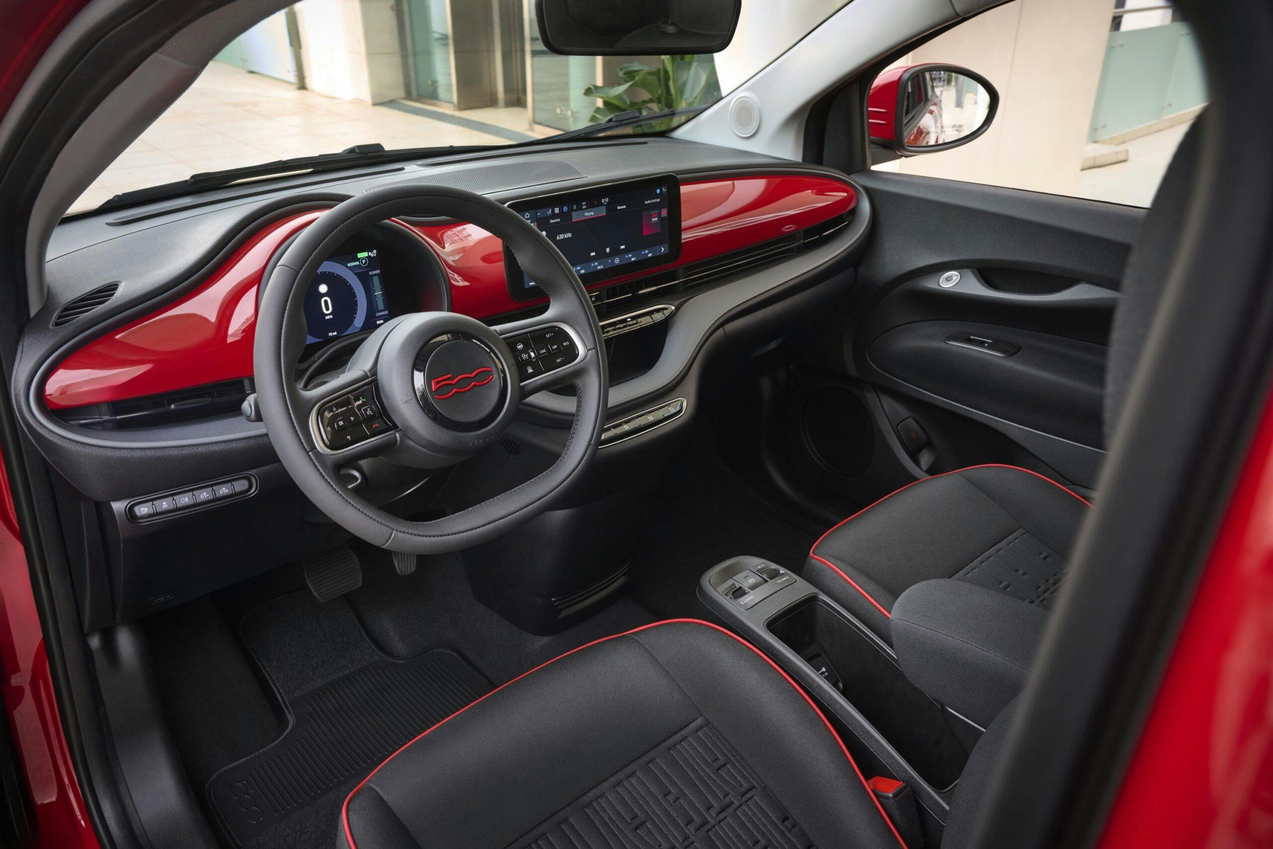 2024 Fiat 500e (RED) interior from driver's door