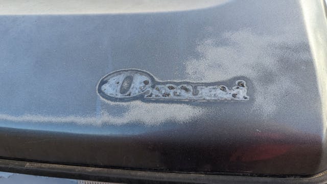 1988 Plymouth Horizon America Omni badge missing patina