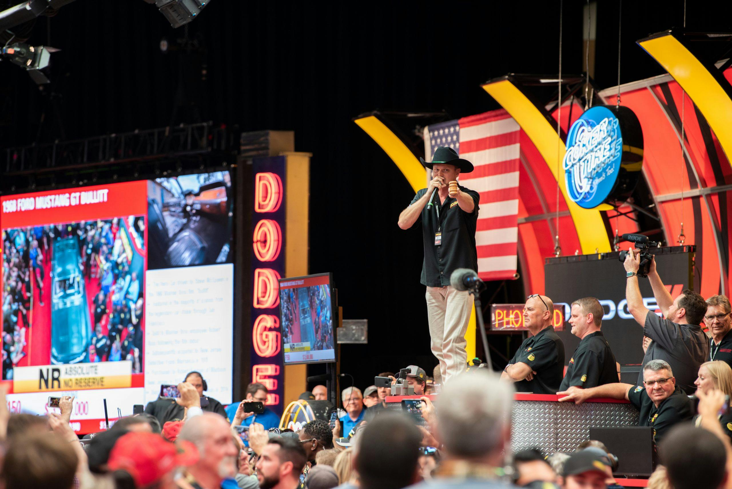 Mecum auctioneer on stage action