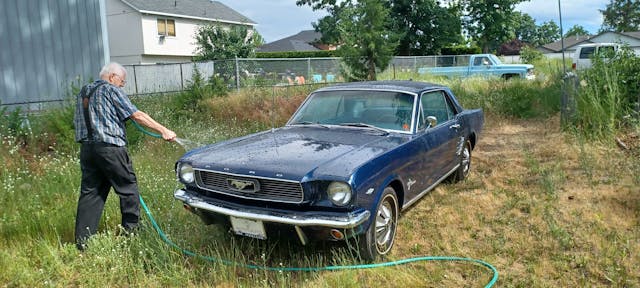 1966 Ford Mustang owner Butler gives car a hose bath