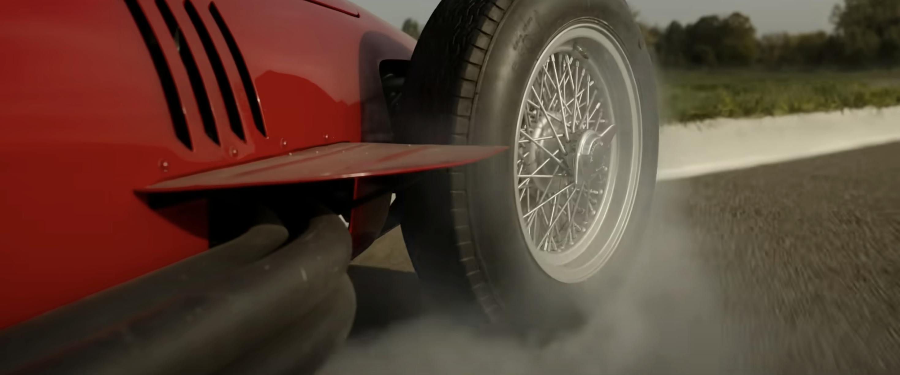 Ferrari film racing action still wheel aero pipes closeup