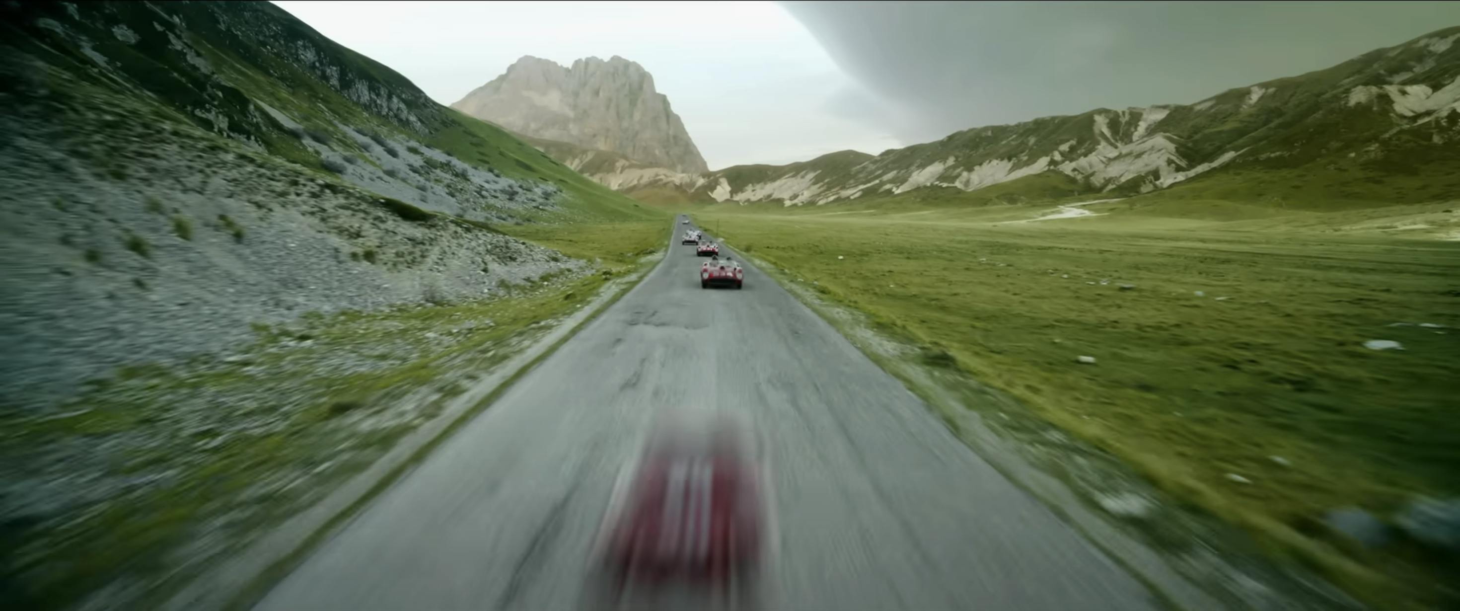 Ferrari film racing action still mountain range