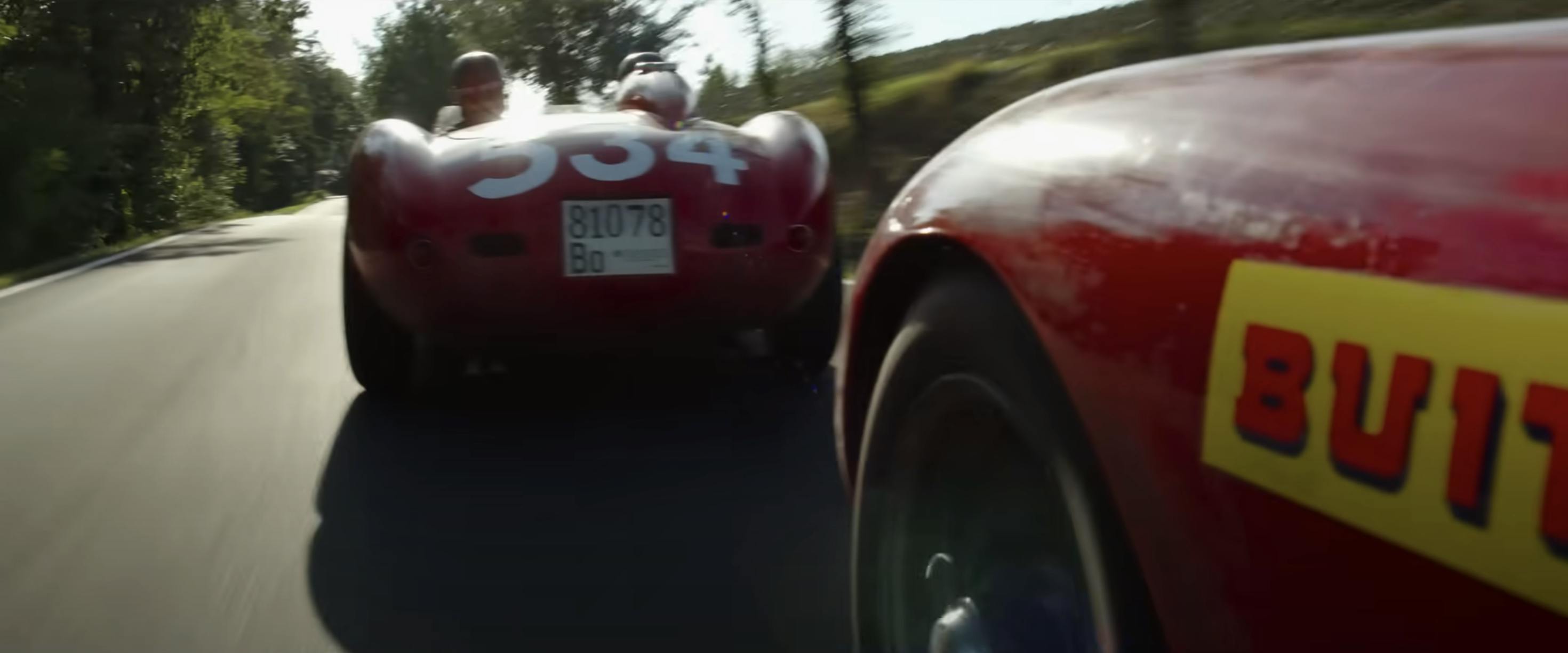 Ferrari film racing action still wheel to wheel