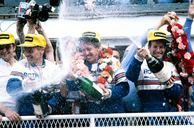 Schuppan (center) with Hurley Haywood (right) and Al Holbert after winning Le Mans in 1983