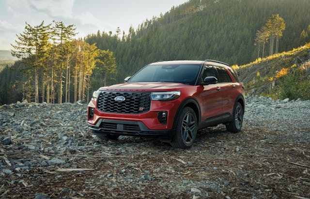2025 Ford Explorer ST exterior front three quarter red on logging trail
