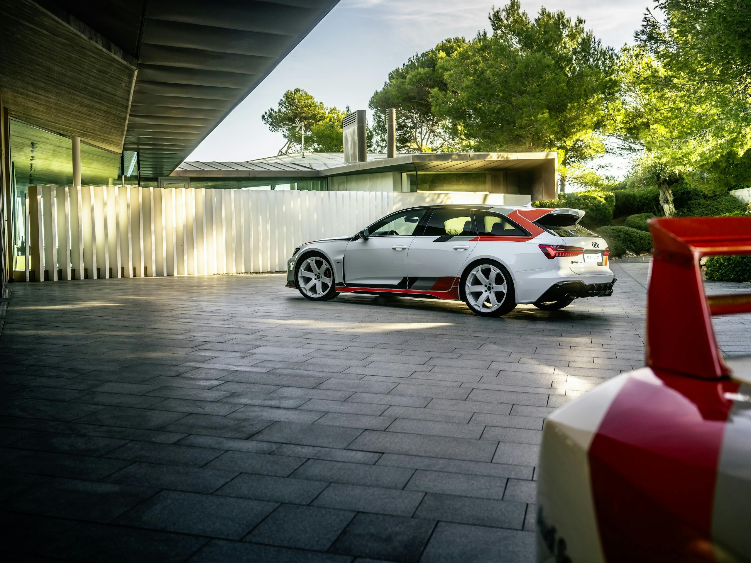 Audi RS 6 Avant GT rear three quarter with RS 6 GTO concept foreground driveway
