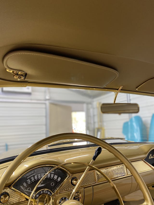 Gold-painted 1955 Chevy Bel Air two-door hardtop interior vertical