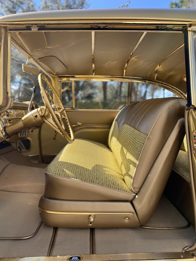 Gold-painted 1955 Chevy Bel Air two-door hardtop interior side view vertical