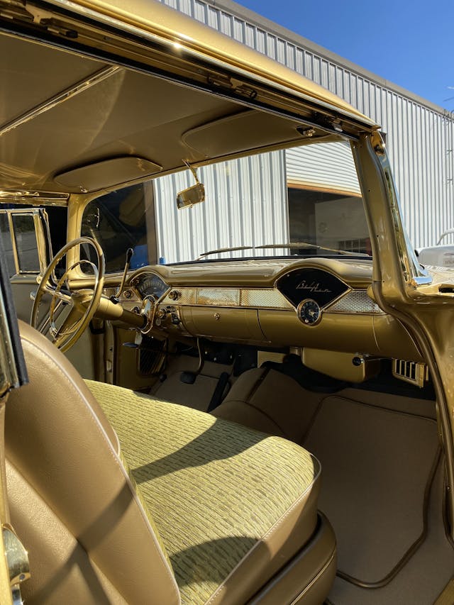 Gold-painted 1955 Chevy Bel Air two-door hardtop interior front dash