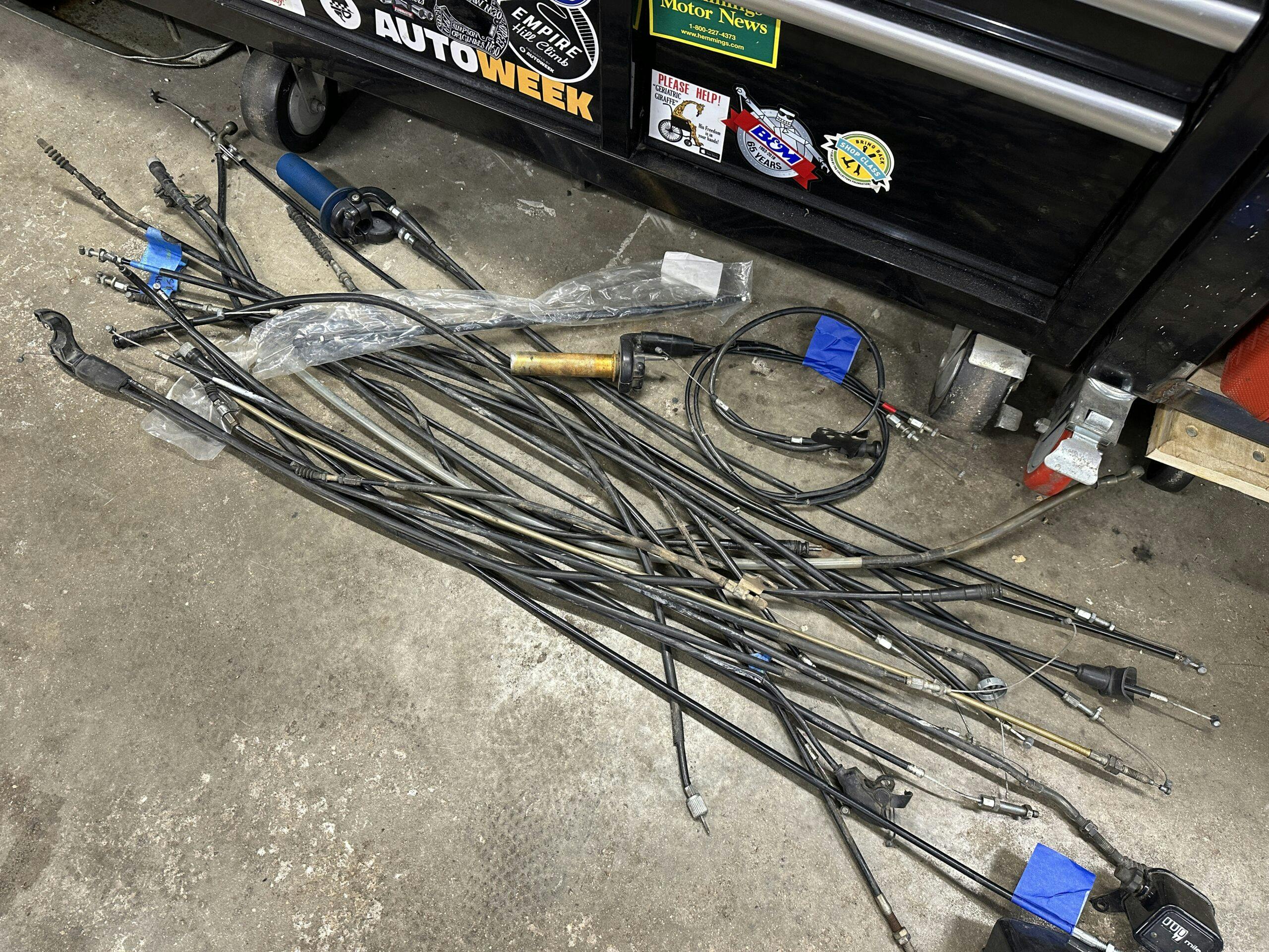 Motorcycle cables on garage floor