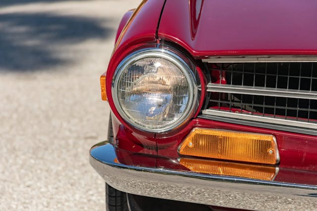 1972 Triumph TR6 headlight grille close up
