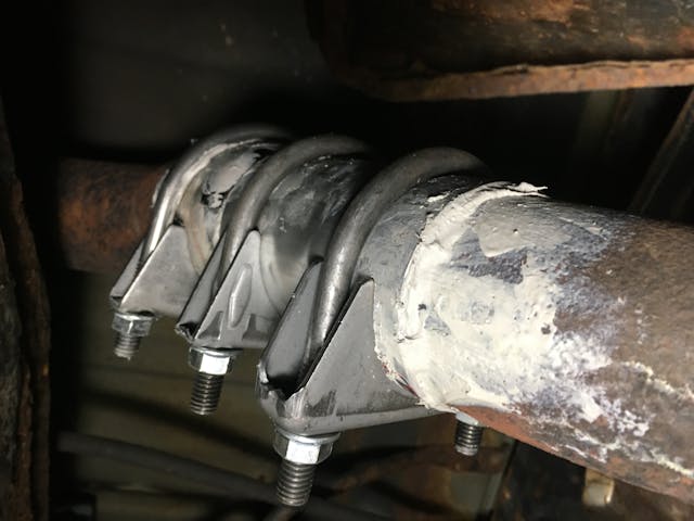 Nissan Armada used suv fixes exhaust putty clamp closeup