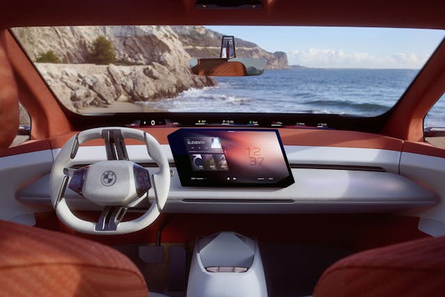 BMW Neue Klasse X interior fron cabin area and dashboard with ocean through windshield