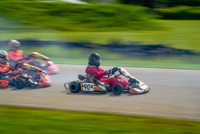 Eddy Eckart in a go-kart, side profile on track