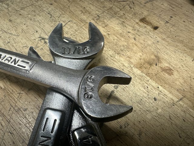 pile of wrench on workbench top