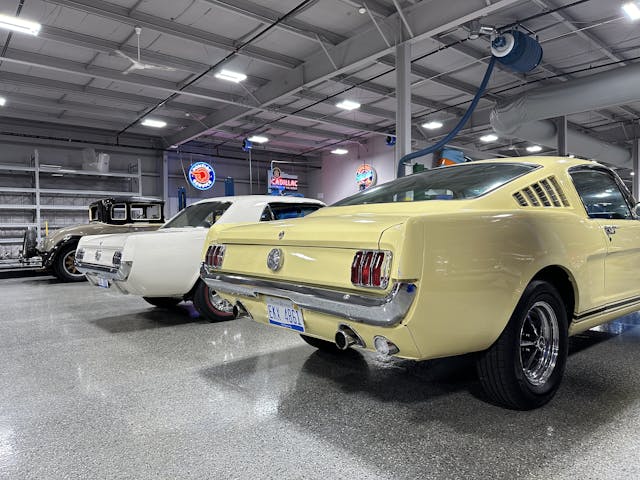 1965 and 1966 Ford Mustangs in Hagerty Learning Garage rear three quarter