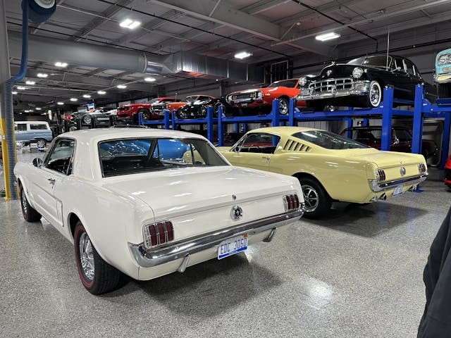 1965 and 1966 Ford Mustangs in Hagerty Learning Garage rear three quarter