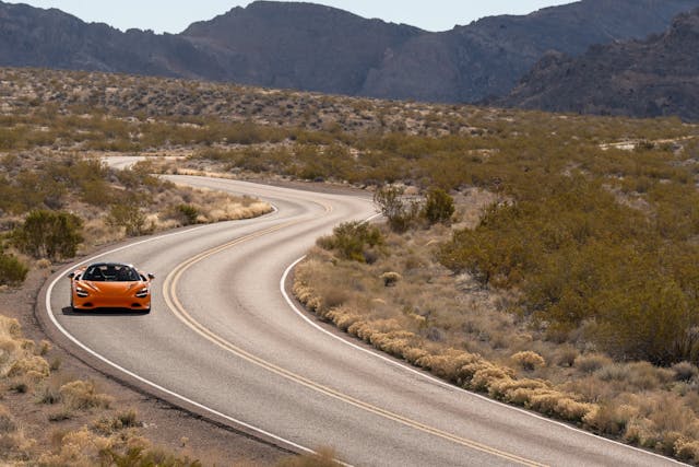 2024 McLaren 750S front road driving action wide curves