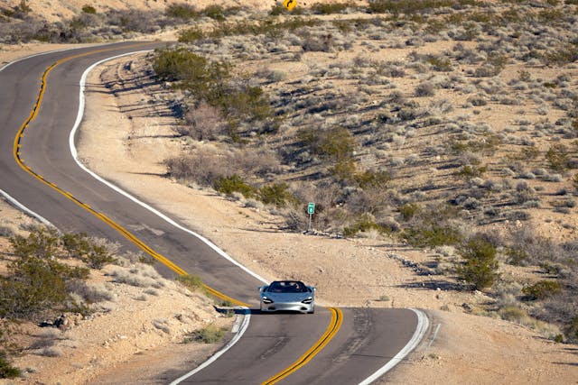 2024 McLaren 750S front road driving action wide