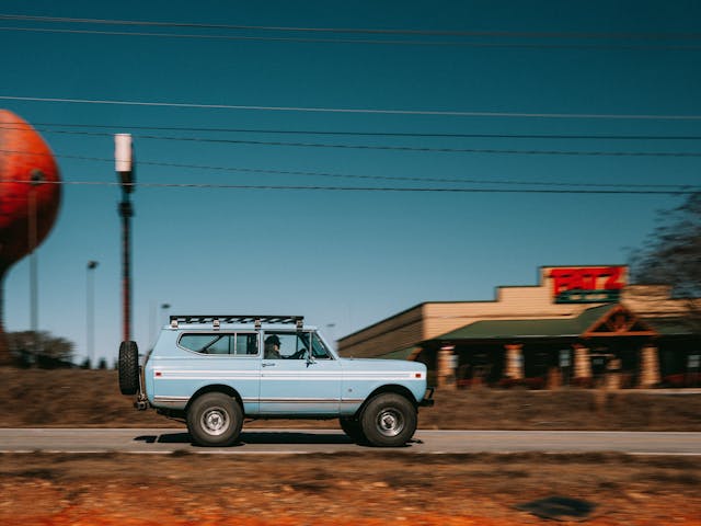 Vintage Scout SUV baby blue on the road Georgia peach