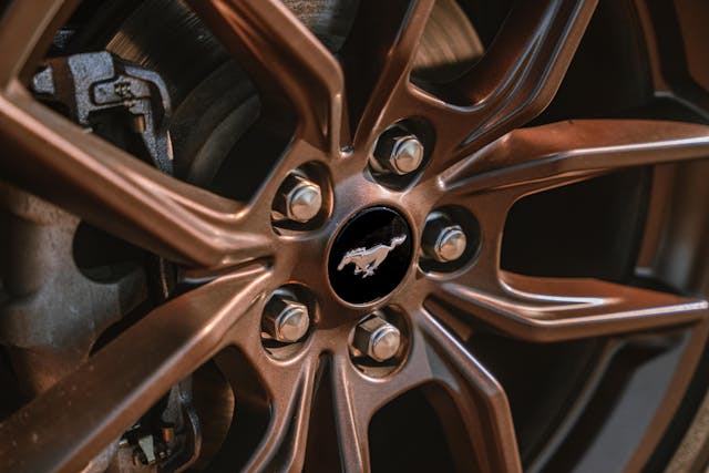 2024 Ford Mustang EcoBoost Convertible Premium exterior bronze wheels center badge detail