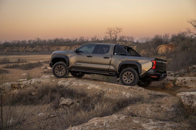 2024 Toyota Tacoma Trailhunter exterior long bed side profile on rocks