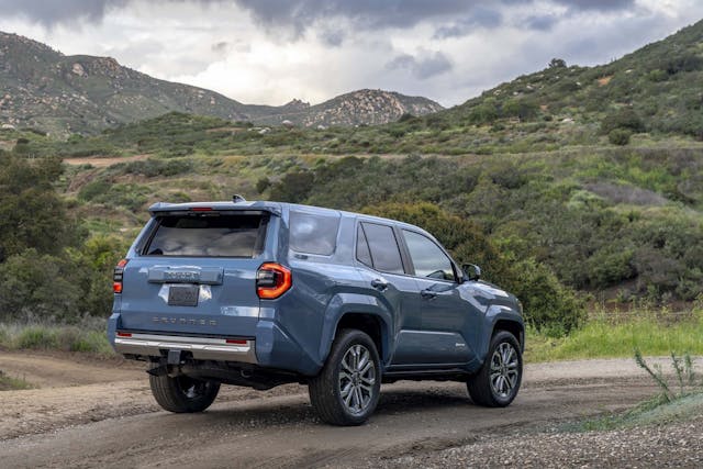 2025 Toyota 4Runner Limited exterior Heritage Blue exterior rear three quarter in mountains