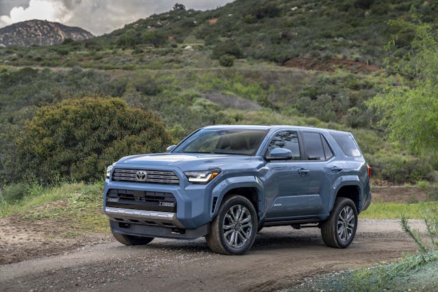2025 Toyota 4Runner Limited exterior Heritage Blue front three quarter in mountains