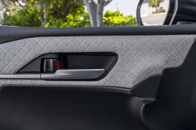 2025 Toyota Camry XLE interior textured fabric detail on door card
