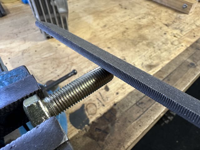 file cutting starter threads on bolt