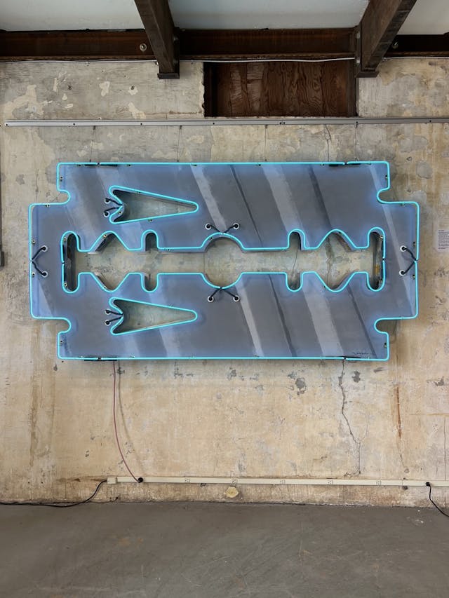 Todd Sanders neon glass art razor blade