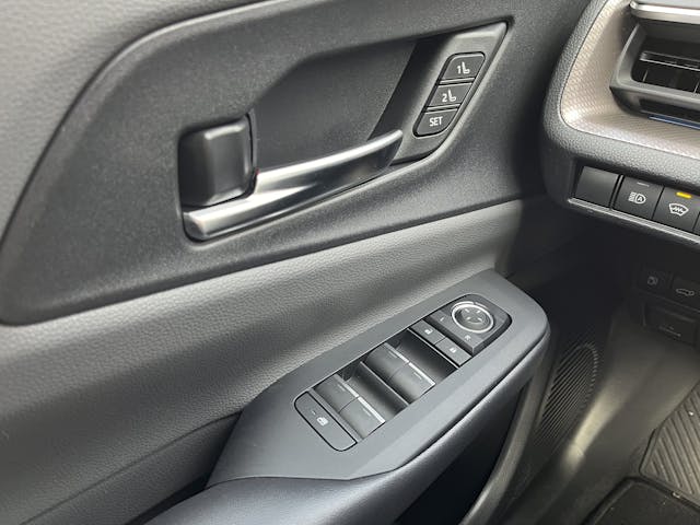 2024 Toyota Prius Limited AWD interior door panel controls closeup