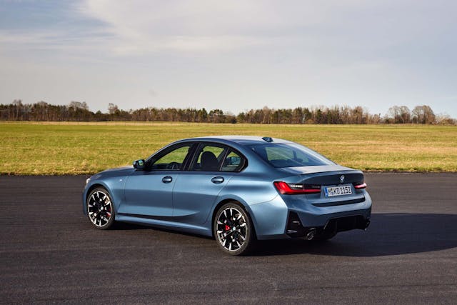 2025 BMW 3 Series exterior blue mid rear three quarter parked on runway