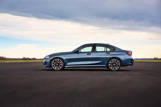 2025 BMW 3 Series exterior blue low side profile parked on runway