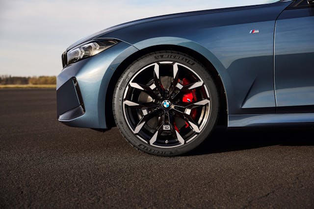 2025 BMW 3 Series exterior blue wheel and tire detail