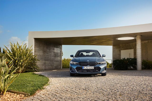 2025 BMW 3 Series exterior blue front end parked at house