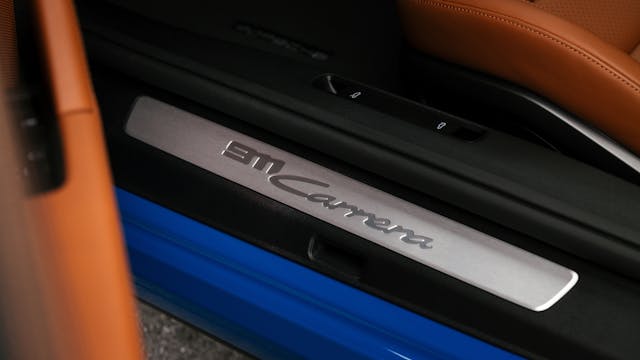 2025 Porsche 911 Carrera Coupe interior door sill kick plate detail