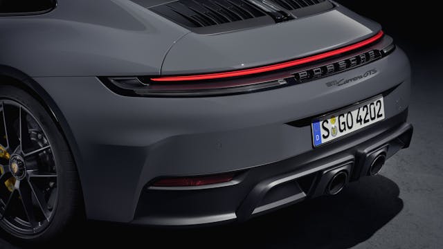 2025 Porsche 911 Carrera GTS Coupe exterior grey rear end detail in studio