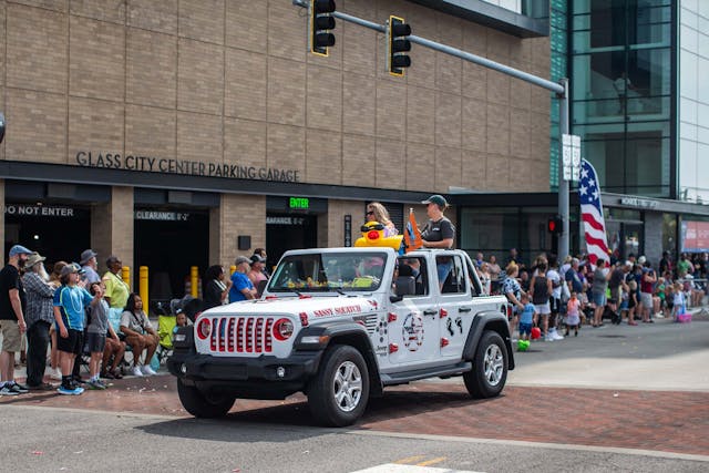 Duck Duck Jeep Toledo Jeepfest white Wrangler cruising in parade