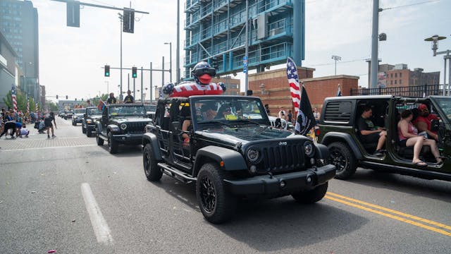 Duck Duck Jeep Toledo Jeepfest black Wranglers in parade with custom doors