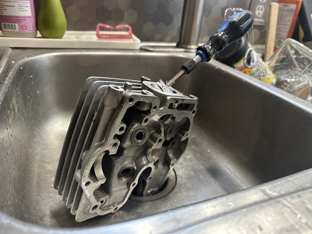 scrubbing xr250r cylinder head in sink