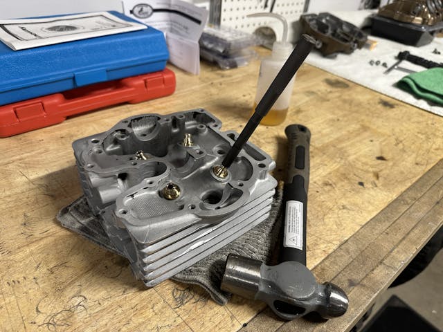 Valve guide installation tool on workbench