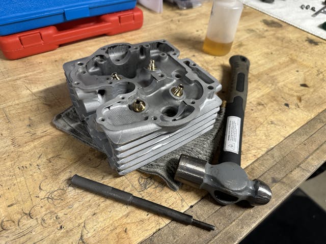 Valve guide installation tool on workbench