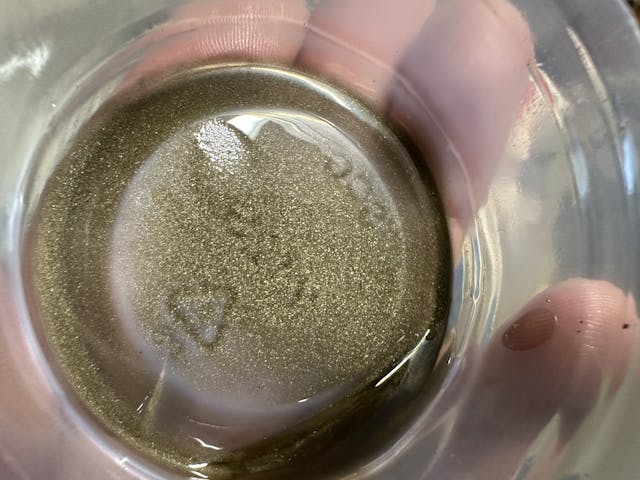 cutting oil with bronze swarf glitter