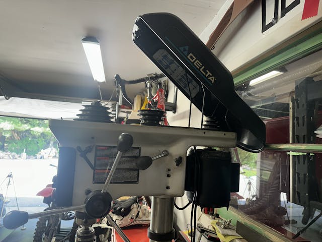 Drill press pulley and belt lid