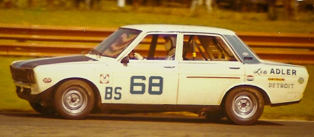 Datsun 510 racetrack racing action